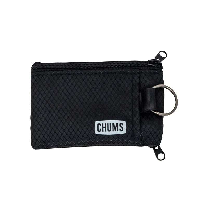 Chums Surfshorts Wallet in black with a textured fabric exterior, dual zipper compartments, and a metal key ring for secure storage and easy access.