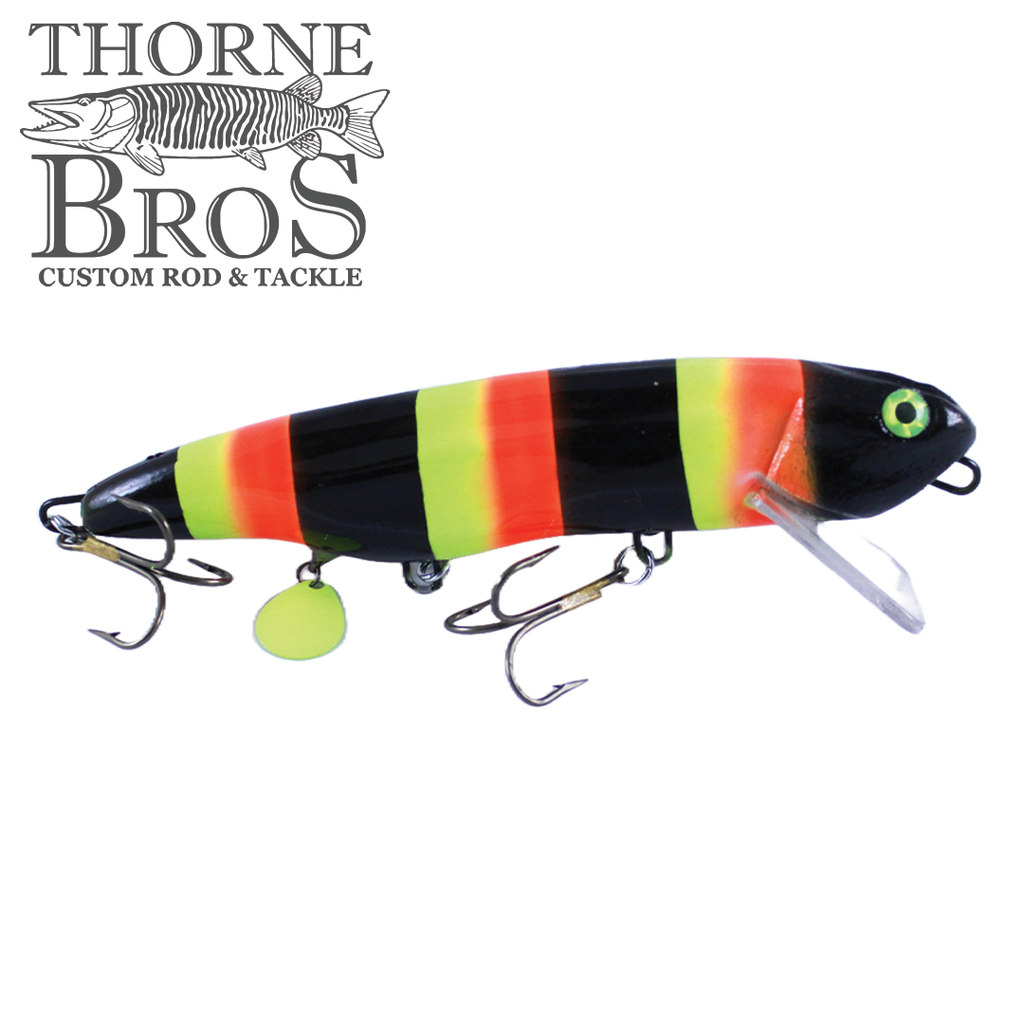 Ty Sennett Vexar fishing lure with bright yellow, orange, and black striped body, detailed eye design, and multiple treble hooks for effective fishing tackle use.