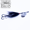 Pandemonium Tackle Marvin 7 Bucktail featuring a black bucktail skirt, silver spinner blade, and dual treble hooks designed for effective fishing tackle use.