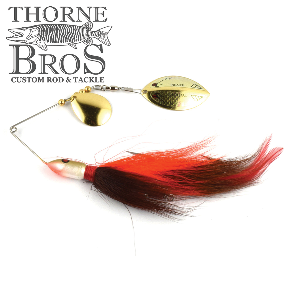 Inhaler RattleTAIL Spinnerbait fishing lure with red and brown fur tail, dual gold spinner blades, designed for musky fishing by Thorne Bros Custom Rod & Tackle.