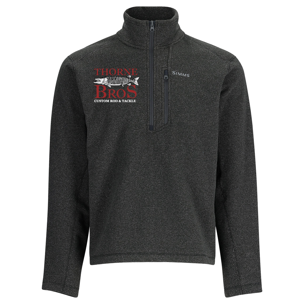 Dark gray quarter-zip pullover with a high collar, featuring the Simms logo on the chest and Thorne Bros. custom rod and tackle logo with a fish graphic on the left side, designed for fishing enthusiasts. Simms Thorne Bros. Logo Rivershed-Half Zip.