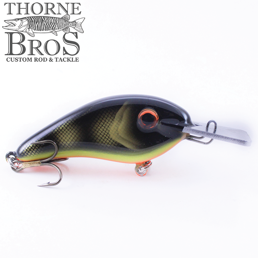 Llungen Chad Shad - Metal Lip (Square) fishing lure with realistic fish scale pattern, dark green and yellow coloring, and sharp treble hooks for effective fishing tackle use.