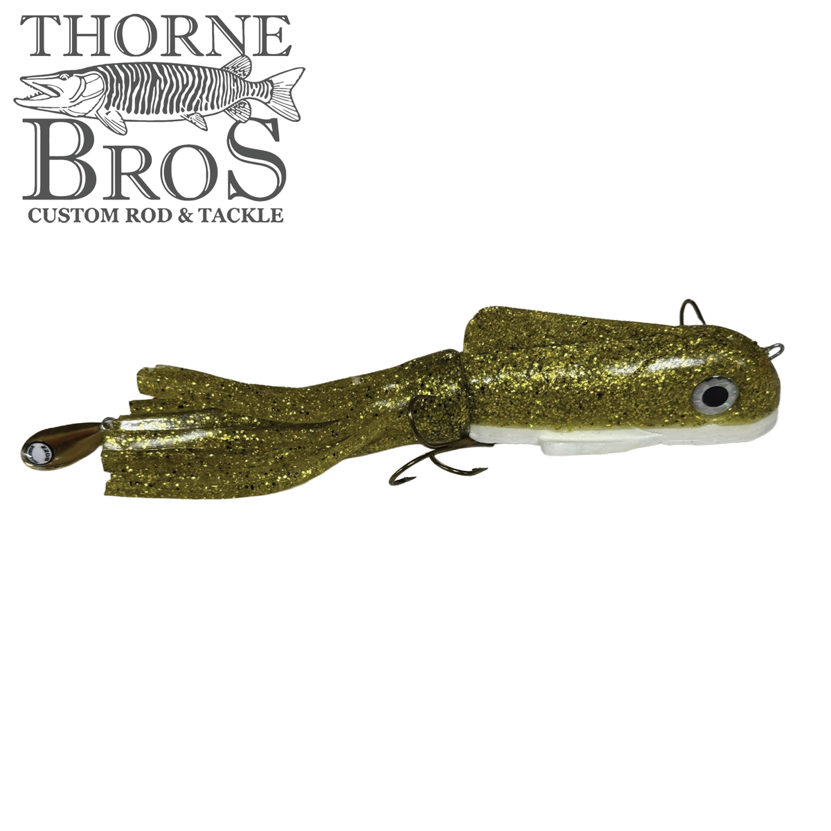 Boss Shad Small Hybrid fishing lure with a segmented, glittery gold body, lifelike eyes, and soft tail designed for effective musky fishing.