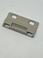 Image of C1010K 23894 Amesbury Truth Positive Action Lock Face Mount keeper.  Known Part Numbers: 2009688, 2009689, 2009690. Almond color metal part on white background.