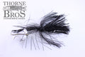 Ruff Tackle Rad Dog Tinsel Buzz fishing lure with black tinsel skirt and silver spinner blades, designed for musky fishing, displayed on white background with Thorne Bros logo.