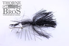 Ruff Tackle Rad Dog Tinsel Buzz fishing lure with black tinsel skirt and silver spinner blades, designed for musky fishing, displayed on white background with Thorne Bros logo.