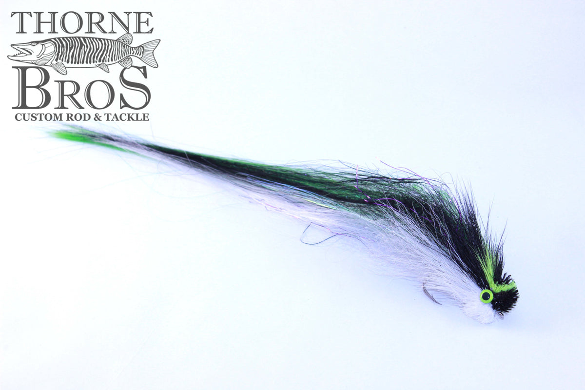 Umpqua Ballok's Big Boy Fly featuring black, white, and green long flowing fibers designed for musky fishing, showcasing detailed craftsmanship by Thorne Bros.
