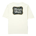 White t-shirt with a camouflage patch and 'Marsh Wear' text on a white background