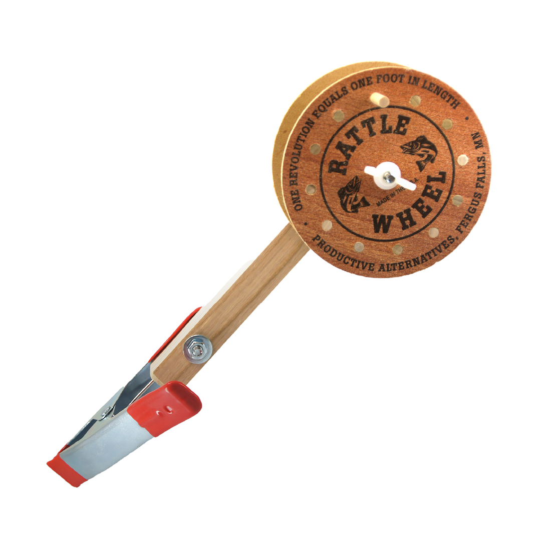 Productive Alternatives Rattle Reels featuring a wooden clamp mount with a round rattle wheel labeled "Rattle Wheel," designed for fishing tackle applications.