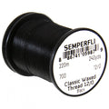 Semperfli Classic Waxed 12/0 black thread spool designed for fly fishing, used for precise tying of fishing lures and tackle.