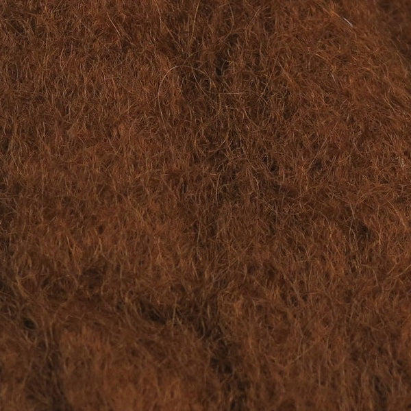 Close-up view of rich brown Sculpin Wool fibers, showing soft, textured material used in crafting fishing lures and tackle for enhanced realism and durability.
