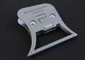Kuchelmiester Multi Clamp fishing tool made of polished metal with a compact design, featuring a central clamp mechanism and measurement markings along the edge.