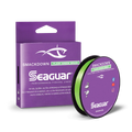 Seaguar Smackdown Braid fishing line in bright green color, shown with spool and purple packaging, designed for high-visibility, ultra-strong fishing tackle use.