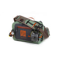 Fishpond Thunderhead Small Submersible Lumbar bag in green and black with brown accents, featuring multiple compartments, a sturdy adjustable strap, and fishing accessory attachments.