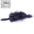 Baby Beaver Mini Beaver fishing lure in black with feathered body, shiny accents, textured tail, and a small weighted head designed for musky fishing.