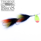 Musky Mayhem Eagletail fishing lure with vibrant black, orange, and yellow feathers, attached to a metallic spinner blade, designed for musky fishing enthusiasts.