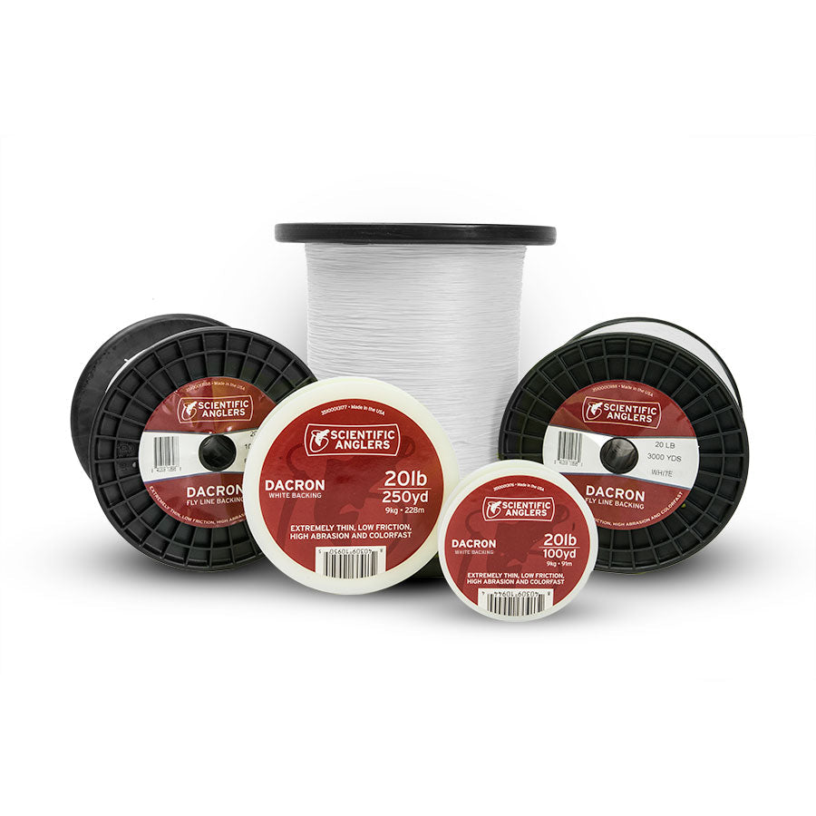 Several spools of white Scientific Anglers Dacron Backing fishing line in various sizes, displayed with labels indicating 20lb test strength for use with fishing rods and reels.