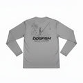 Dogfish Tackle & Marine grey long sleeve microfiber performance shirt with skeleton fishing graphic on beach.