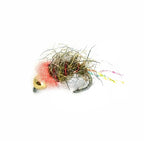 Close-up of a Tungsten Pink Squirrel fishing lure featuring a gold weighted head, fuzzy pink collar, and a body wrapped in natural-colored dubbing with reflective strands, designed for musky and fly fishing tackle.